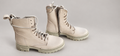 Steve Madden light combat boots on professional studio background