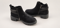 Wanted black chunky ankle boots on professional studio background